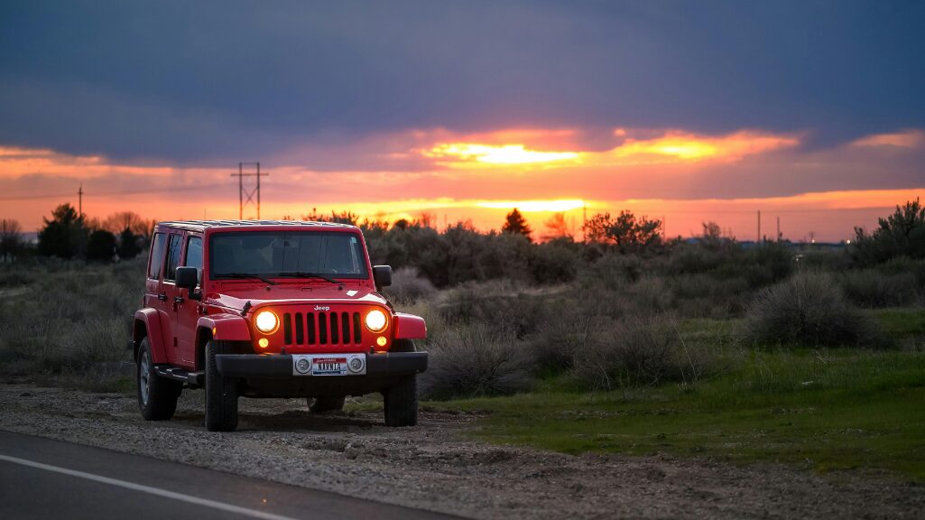 Red Jeep at sunset